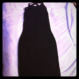 Simple black midi dress with creative back.